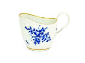 A Worcester Porcelain Cream Jug, circa 1770, of ovoid form and with scrolling handle, decorated with