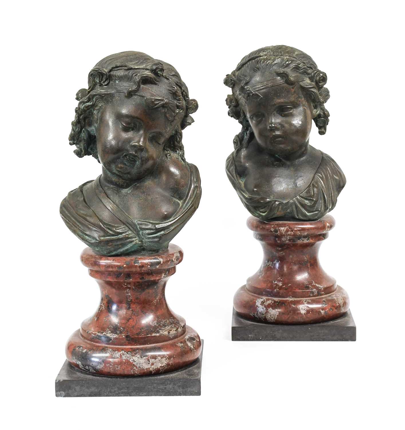 French School (19th century): A Pair of Bronze Busts of Young Girls, each with their hair tied back,