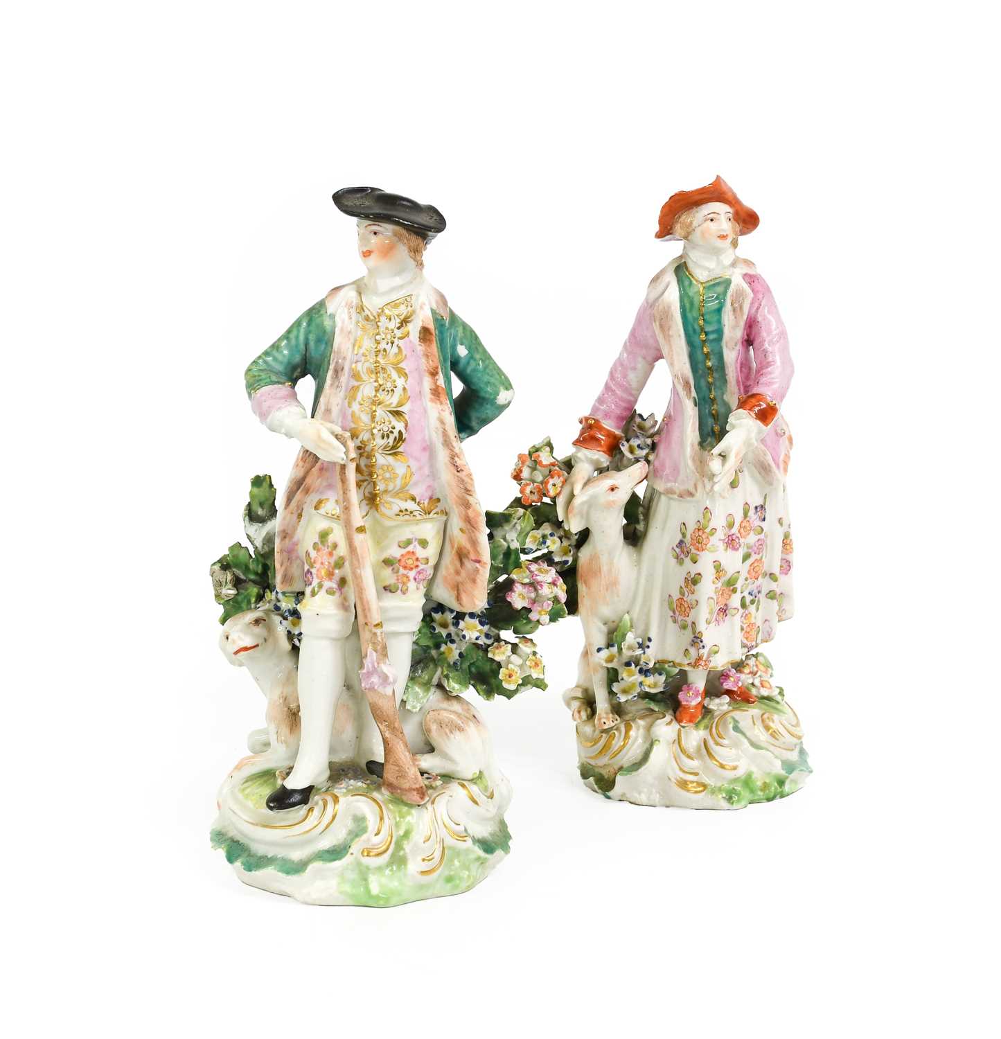 A Near Pair of Derby Porcelain Figures, circa 1770, modelled as a sportsman and his companion, stood