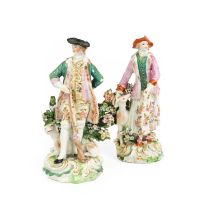 A Near Pair of Derby Porcelain Figures, circa 1770, modelled as a sportsman and his companion, stood
