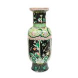 A Chinese Porcelain Rouleau Vase, Xuande mark but 19th century, painted in famille noir enamels,