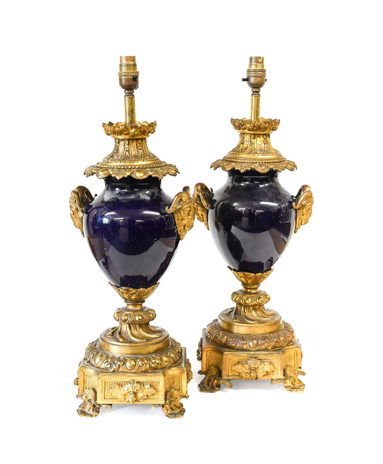 A Pair of Gilt-Metal-Mounted Blue-Glazed Lamp Bases, in Louis XV style, of ovoid form with ram's