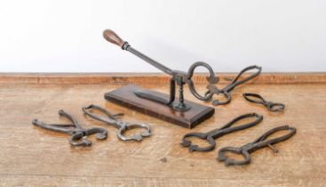 A Pair of Steel Sugar Cutters, 19th century, with turned handle and mounted on a moulded rectangular