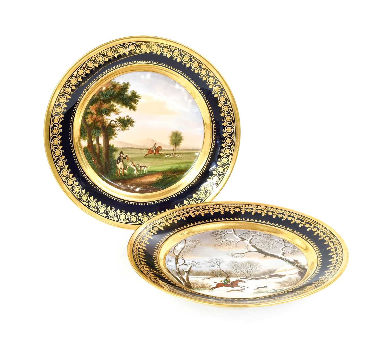 Two Darte Porcelain Plates, circa 1810, with gros bleu and tooled gilt borders framing painted