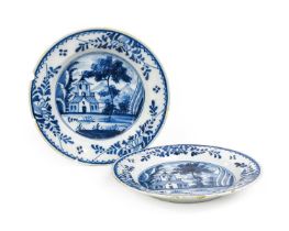 A Pair of English Delft Plates, circa 1750, painted in blue with landscape roundels each with a