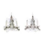 A Pair of Cut Glass Twin-Light Wall Sconces, late 19th century, with mineret finials and scroll