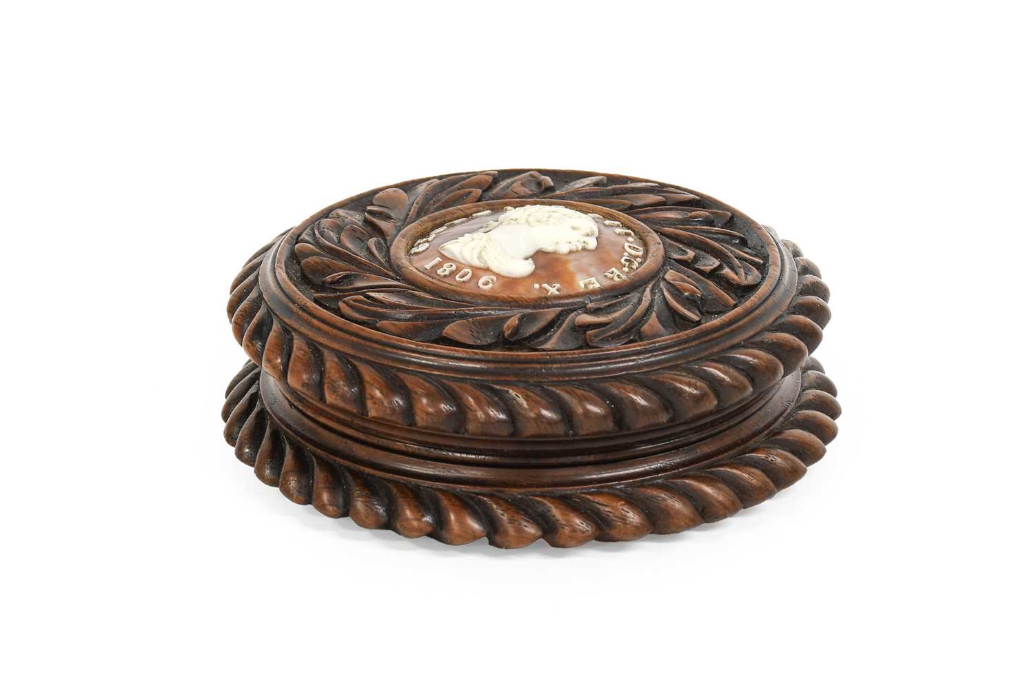 A George III Commemorative Walnut Snuffbox and Cover, dated 1806, of circular form, the cover set