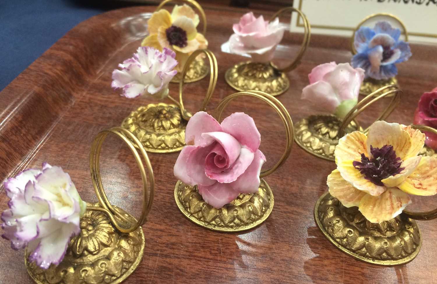 A Set of Fourteen Porcelain-Mounted Gilt Metal Place Card Holders, early 20th century, each with a - Image 3 of 5
