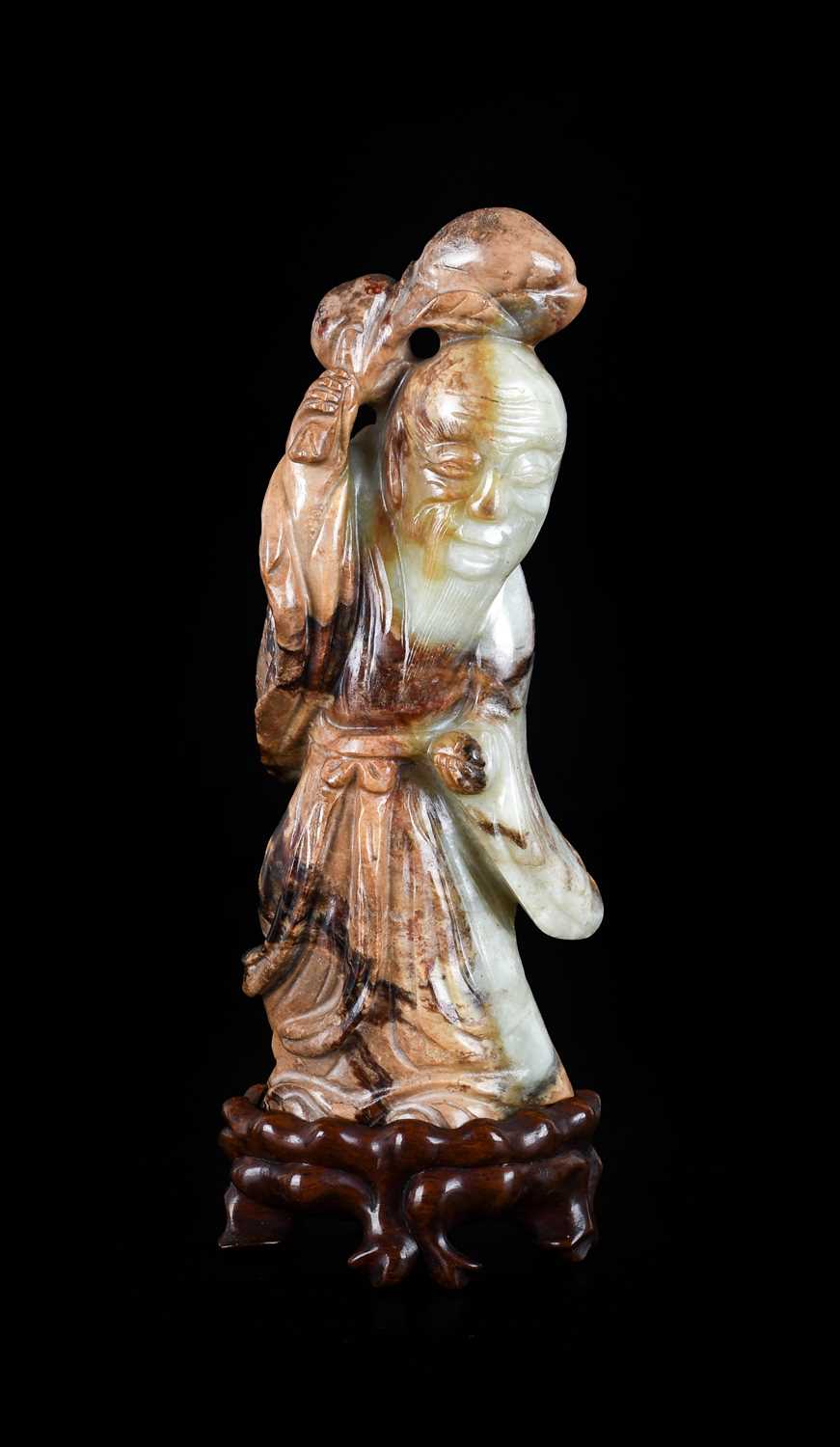 A Chinese Pale Celadon and Mottled Brown Jade Figure of Shoulao, in Ming style, probably late 18th/ - Image 2 of 17