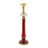 A Gilt-Metal-Mounted Ruby Glass Lamp Base, late 19th/early 20th century, of panelled slender