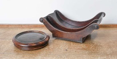 A George III Mahogany Cheese Coaster, circa 1790, of scoll form with turned roundels, on small brass