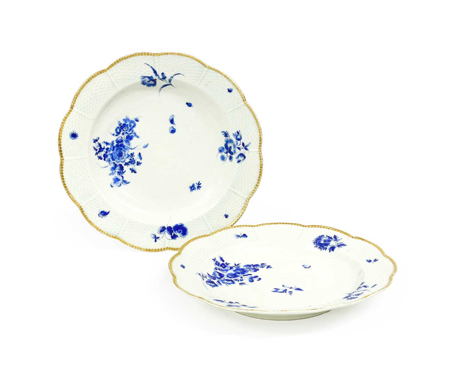 A Pair of Worcester Porcelain Dessert Plates, circa 1770, with lobed ozier borders, having gilt