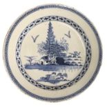 An English Delft Charger, circa 1760, painted in blue with a chinoiserie landscape within a