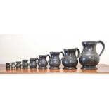 A Matched Graduated Set of Nine Baluster Pewter Measures, 19th century, various inscribed and with