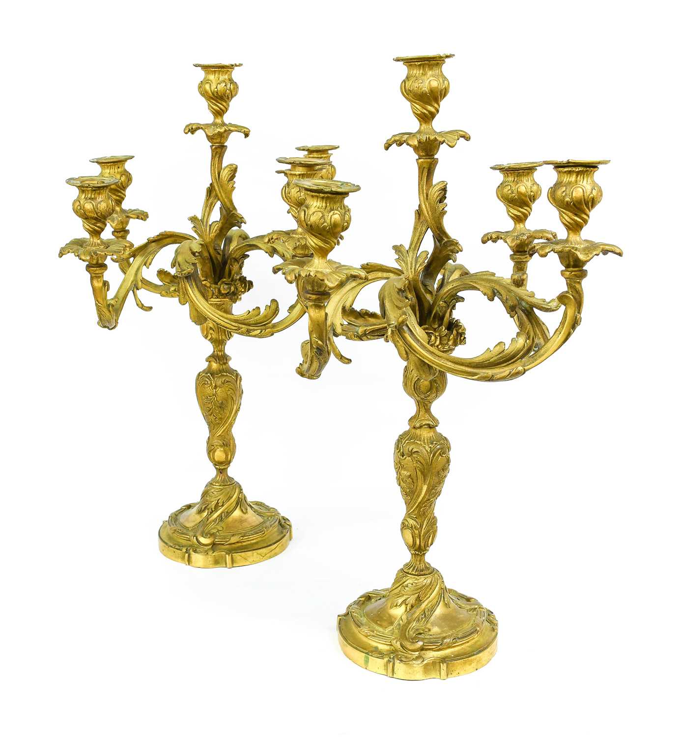 A Pair of Gilt Bronze Five-Light Candelabra, in Louis XV style, with leaf-sheathed sockets and