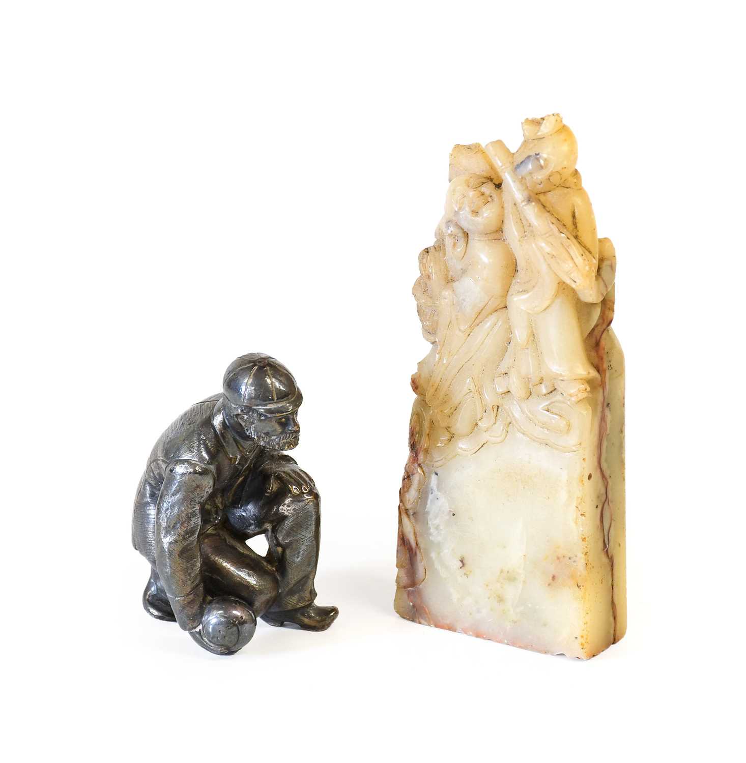 A Chinese Soapstone Hand Seal, late Qing Dynasty, carved with figures on a rectangular base