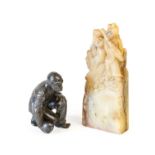 A Chinese Soapstone Hand Seal, late Qing Dynasty, carved with figures on a rectangular base
