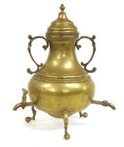 An English Brass Tea Urn and Cover, circa 1730, of baluster form with foliate sheaf scroll handles