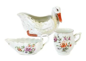 A Derby Porcelain Sauceboat, circa 1760, of fluted form and with scrolling handle, painted in