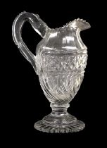 A Regency Cut Glass Water Jug, of baluster form with bands of geometric cutting on a stepped