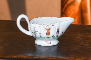 A Derby Porcelain Creamboat, circa 1760, of fluted ovoid form and with plain strap handle, having