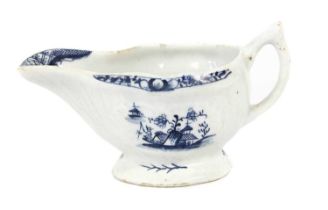 A Lowestoft Porcelain Butterboat, circa 1770, strap fluted and painted in underglaze blue with