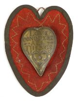 A Brass Sweetheart's Nosegay, late 17th century, of heart shape, inscribed LOVE CONQUERS ALL