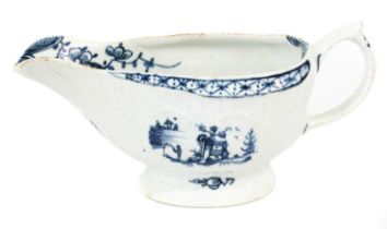 A Lowestoft Porcelain Sauceboat, circa 1765-1775, strap fluted and with foliate cartouches,