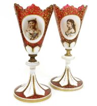 A Pair of Bohemian White-Overlay Ruby Glass Goblet Vases, circa 1880, of tulip form with raised oval