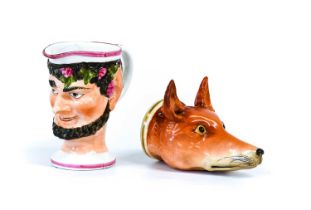 A Porcelain Stirrup Cup Formed as a Fox Head, early 19th century, probably Staffordshire, painted in
