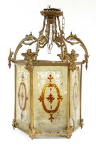 A Victorian Gold-Painted Metal Hexagonal Hall Lantern, with leaf scroll supports, the etched and