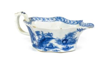 A Bow Sauceboat, circa 1755, of flat bottomed leaf form, painted in underglaze blue with the "