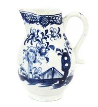 A Lowestoft Porcelain Sparrowbeak Jug, circa 1765, painted in underglaze blue with a fence, rock and