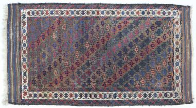 Baluch Rug Northeast Iran, circa 1900 The field with diagonal columns of hooked güls enclosed by