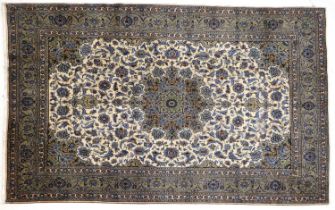 Kashan Carpet Central Iran, circa 1970 The ivory ground of scrolling vines centred by a flowerhead