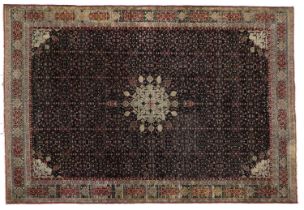 Agra Carpet North India, Circa 1890 The midnight blue field of intricate vines centred by and "