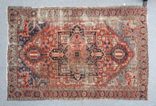 Heriz Carpet North West Iran, late 19th century The terracotta field centred by a salmon pink and