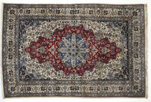 Nain Carpet Central Iran, Circa 1960 The blood red field centred by a sky blue medallion framed by