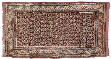 Kurdish Rug North West Persia, circa 1920 The charcoal field with a one-way boteh design and by