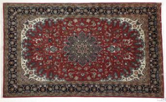 Tabriz Carpet North West Iran, modern The faded plum field of scrolling vines centred by a deep