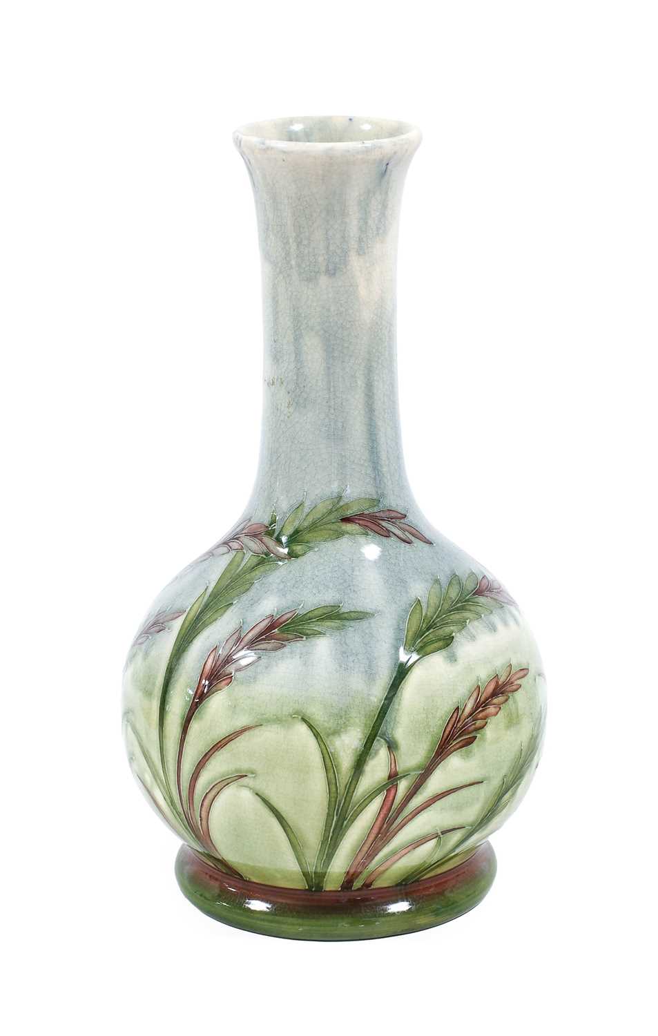 William Moorcroft (1872-1945): A Waving Corn Pattern Vase, on a pale ground, green painted