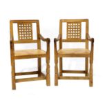 Workshop of Robert Mouseman Thompson (Kilburn): Two English Oak Lattice Back Arm Chairs, 1978, tan