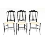 A Set of Three Mid Century Italian Ebonised Beech Chiavari Chairs, after a design by Giuseppe