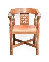 Workshop of Robert Mouseman Thompson (Kilburn): An English Oak Monk's Chair, with curved back and