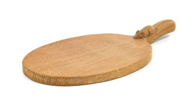 Workshop of Robert Mouseman Thompson (Kilburn): An English Oak Cheese Board, post 1960, of