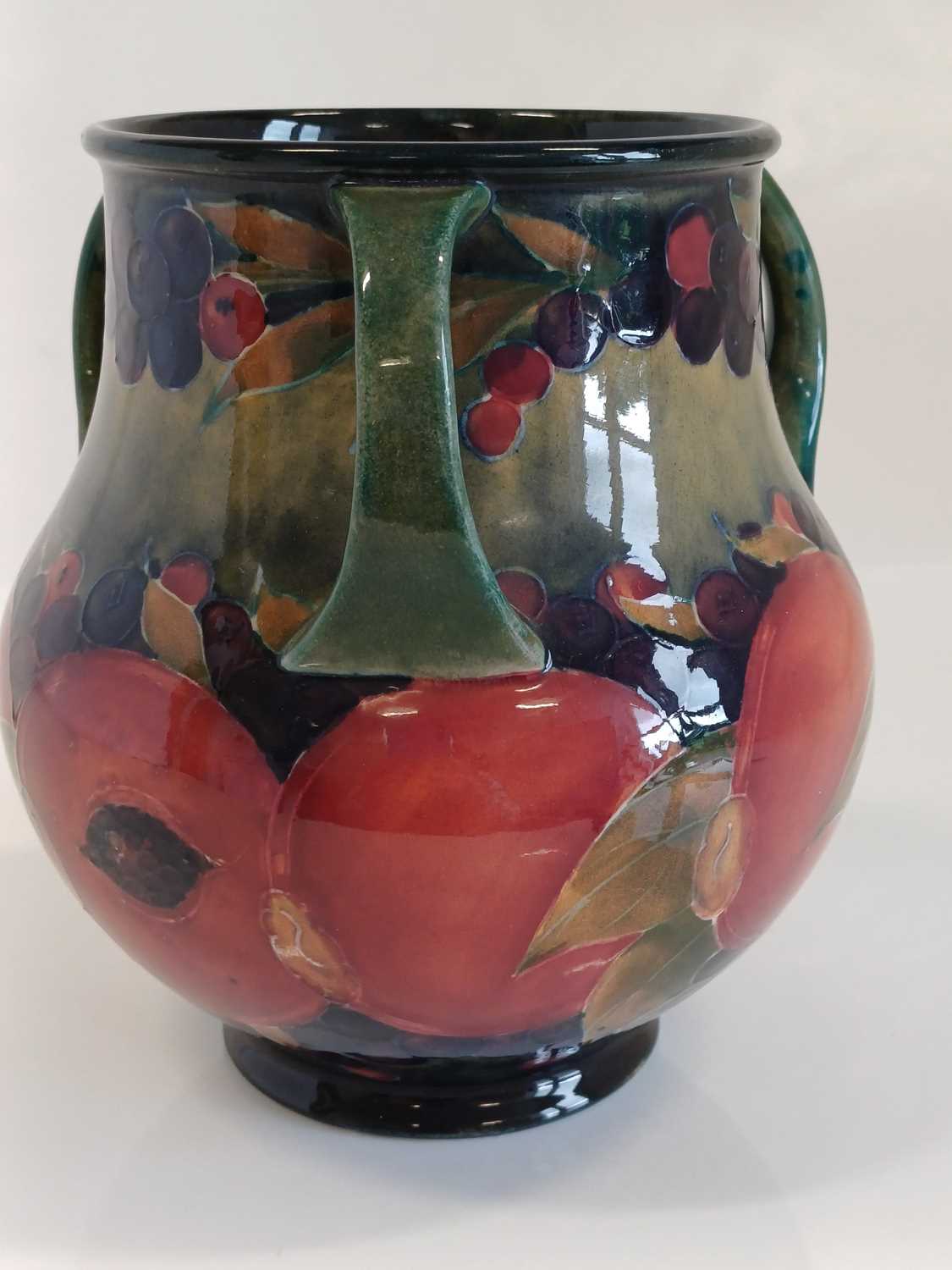 William Moorcroft (1872-1945): A Pomegranate Pattern Three-Handled Vase, on a green/blue ground, - Bild 7 aus 13