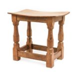 Workshop of Robert Mouseman Thompson (Kilburn): An English Oak Dish Top Stool, the rectangular