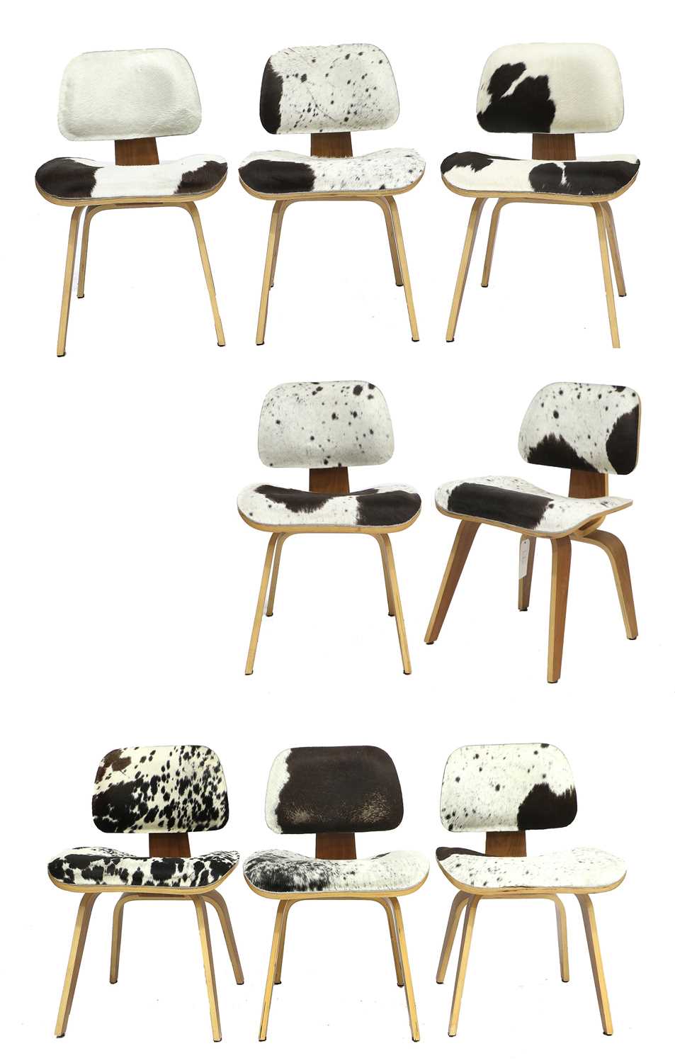 A Set of Eight Eames DCW Style Lounge Chairs, walnut veneered plywood frame, cow hide upholstered