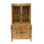 Workshop of Robert Mouseman Thompson (Kilburn): An English Oak Drinks Display Cupboard, the leaded