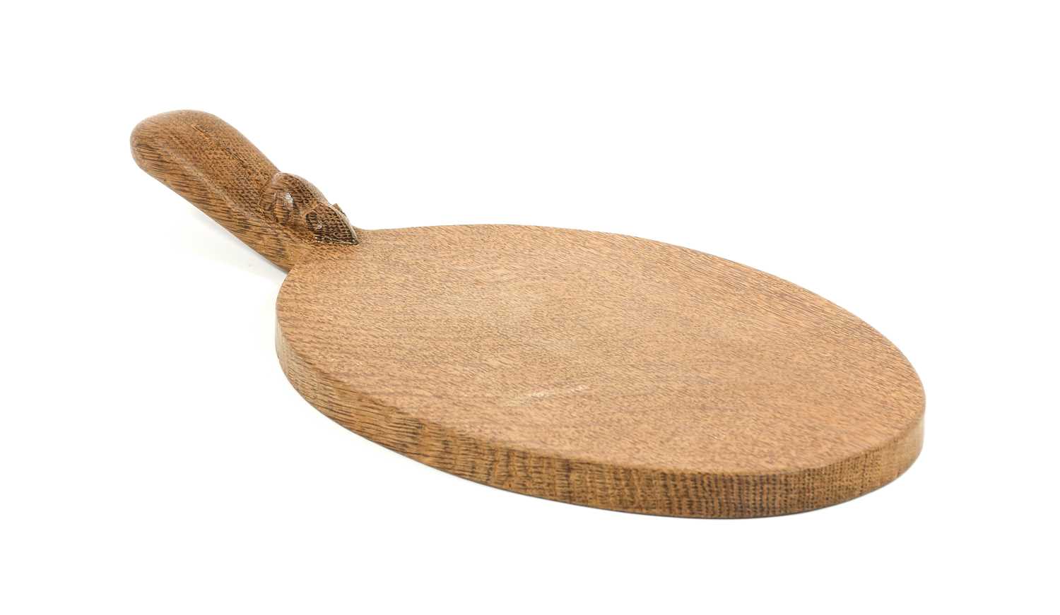 Workshop of Robert Mouseman Thompson (Kilburn): An English Oak Cheese Board, post 1960, of